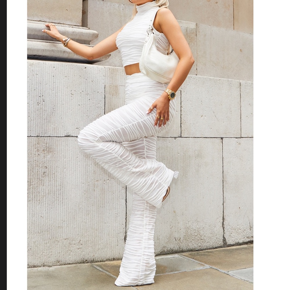 Matching set cream pleated jersey sleeveless crop top with skinny flared pants